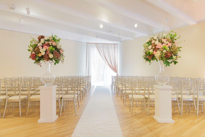 Wedding ceremony inside the Center, with chiavari chairs